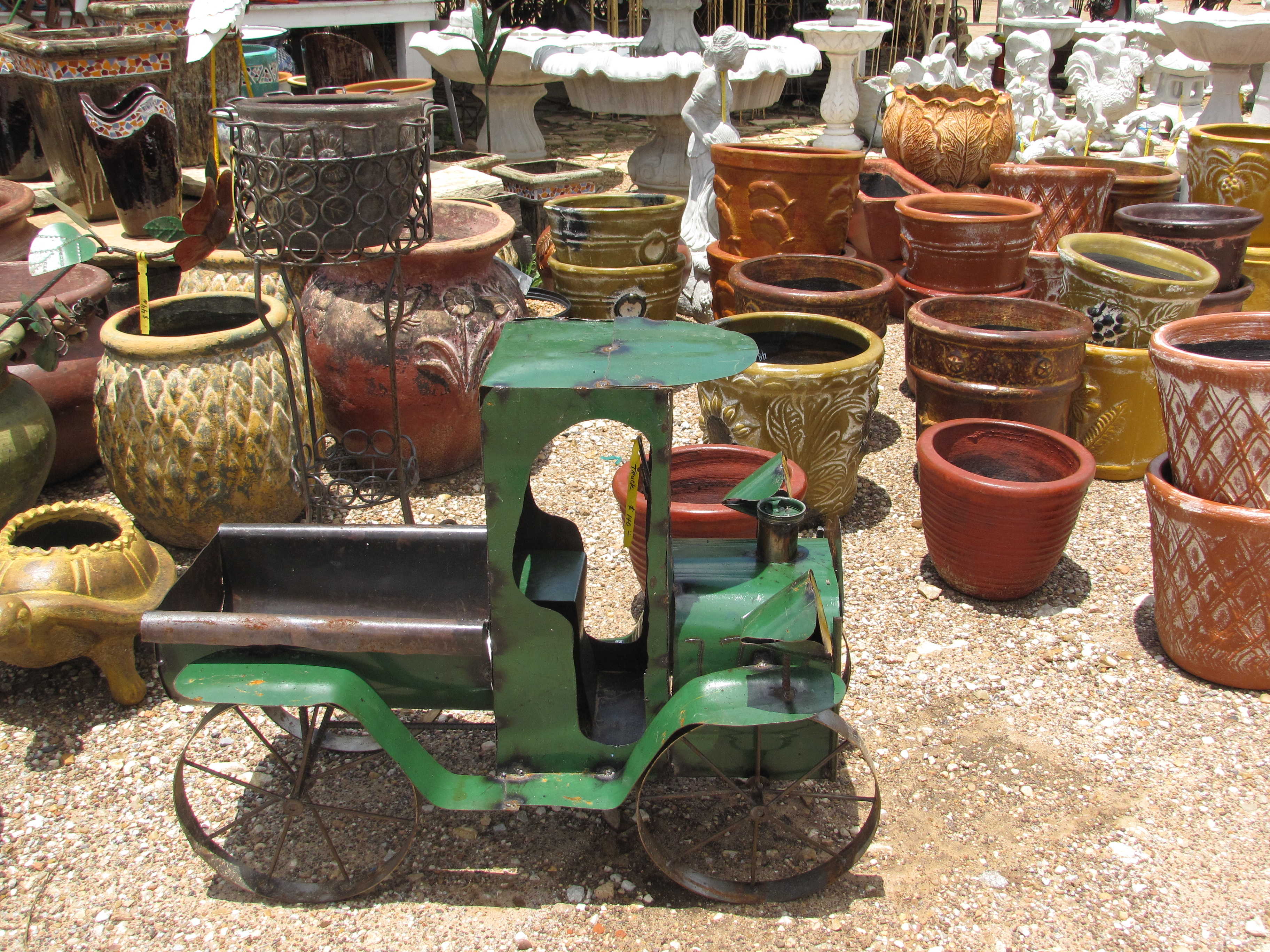 Many kinds of yard decor such as iron, cement and pottery at J&J Nursery, Spring, TX.